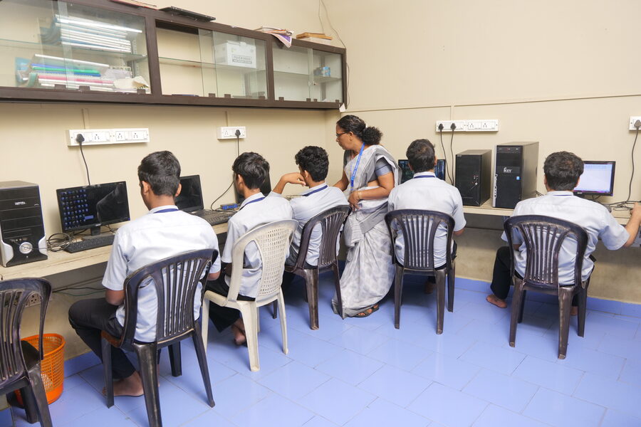 Students at desktop computers in the computer lab