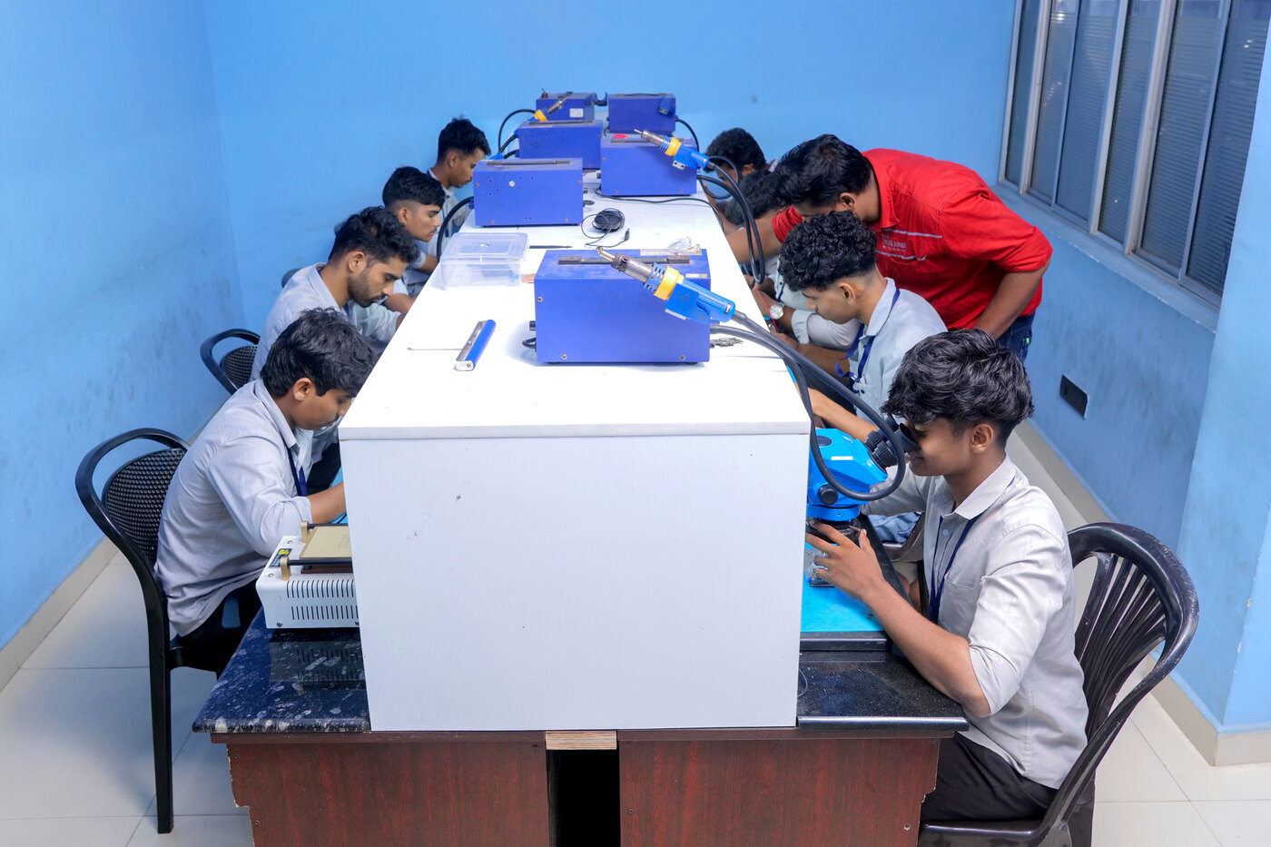 Students soldering in the chip-level lab